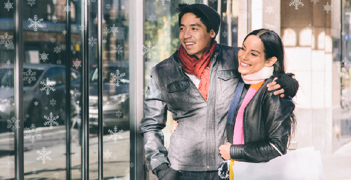 Asian couple window shopping
